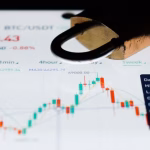 a close up of a business card with a stock chart on it
